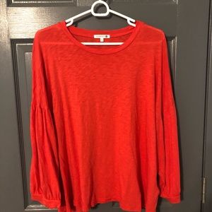 Sundry Top from Anthropology in coral color. The sleeves are quarter length.